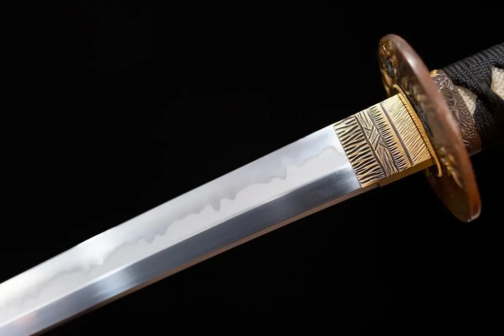 Upper T10 clay‑tempered katana blade brass habaki sanbonsugi three‑cedar‑tree flowing‑undulating hamon temper‑line macro close‑up