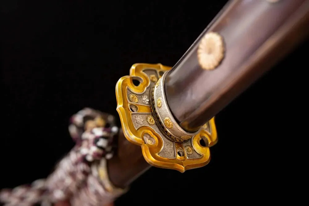 Reverse‑side imperial‑chrysanthemum‑blossom carving gilded‑vintage alloy tsuba surface texture close‑up