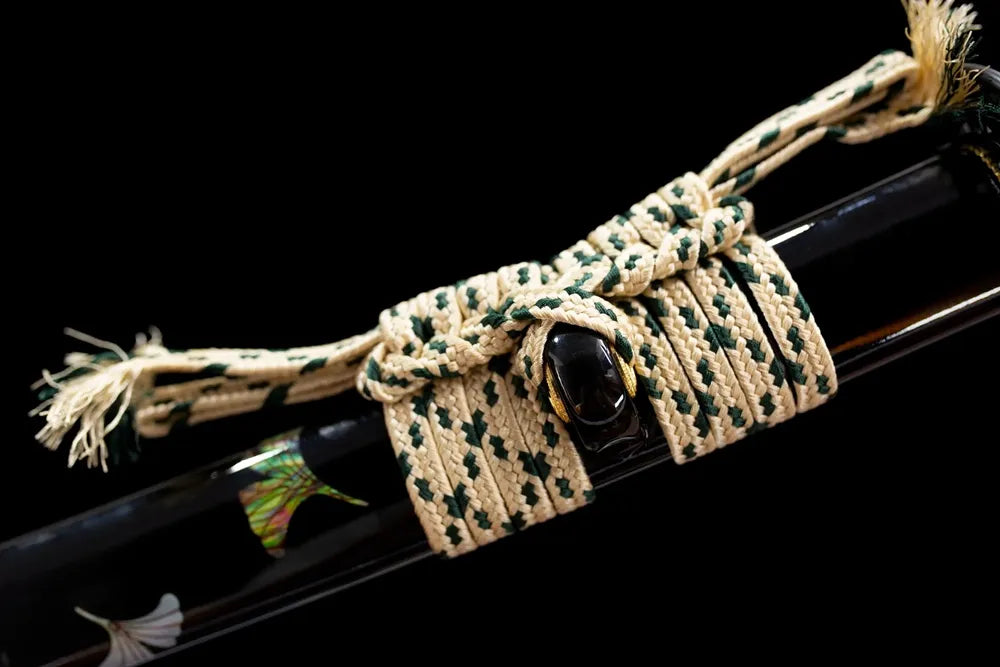 Thin cream‑gold mixed braided sage cord brass‑toned alloy fitting macro close‑up
