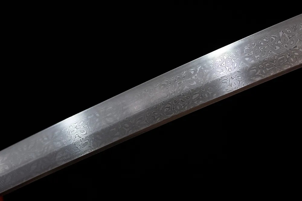 Mid‑section botanical‑etch flowing‑garden‑scenery patterned damascus steel katana blade surface close‑up shot