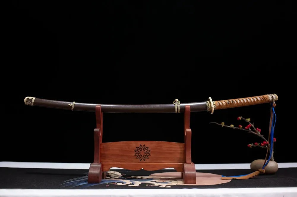 Horizontal laid closed dark‑brown vintage 98‑style saber scabbard flat table‑top front display