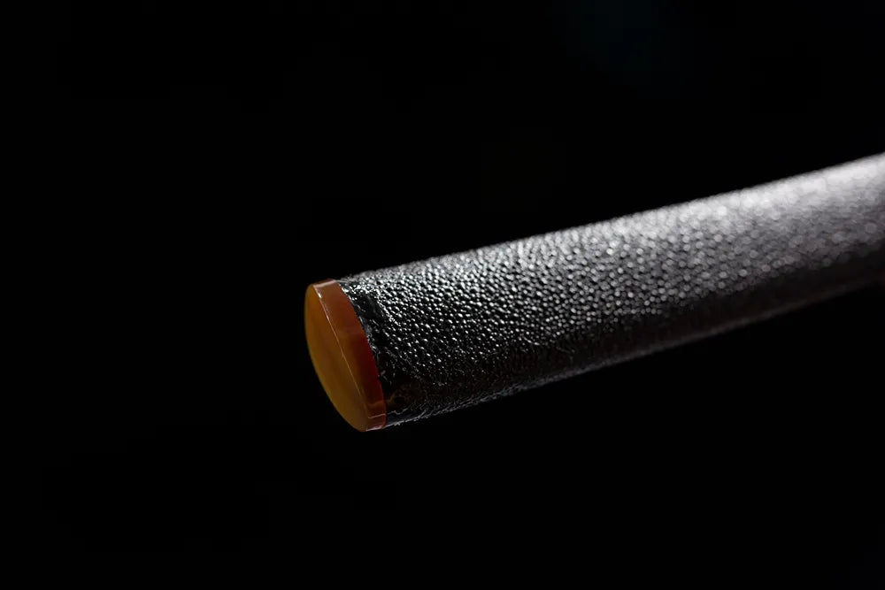 Bottom amber wood cap black grain saya close shot