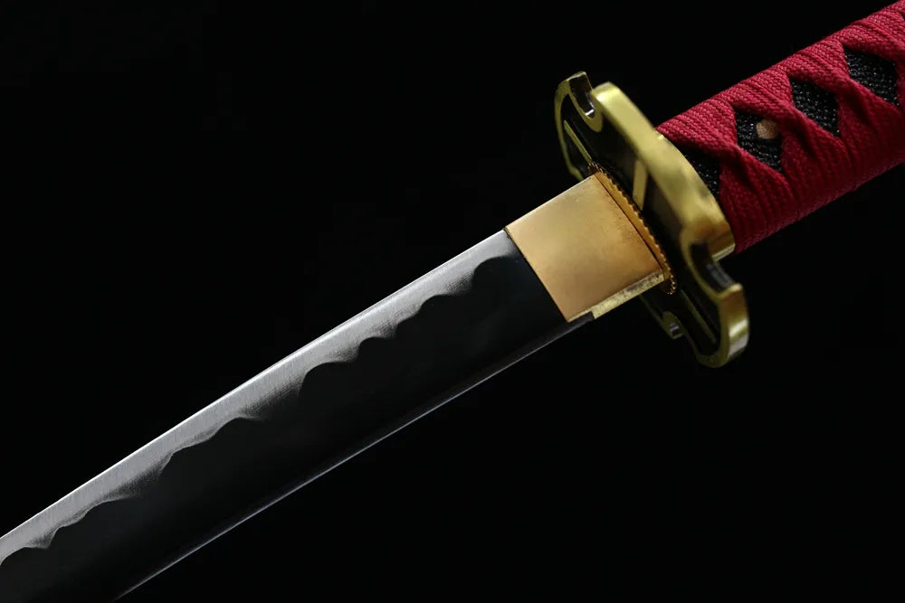 Upper 1060 steel blade cross‑style alloy habaki macro close‑up