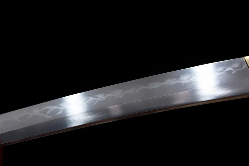 Mid‑section clean suguha straight‑line hamon steel wakizashi blade surface close‑up shot