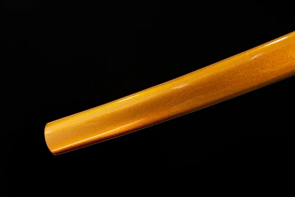 Bottom deep‑ocean‑blue saya aged‑copper kojiri end‑cap close‑up