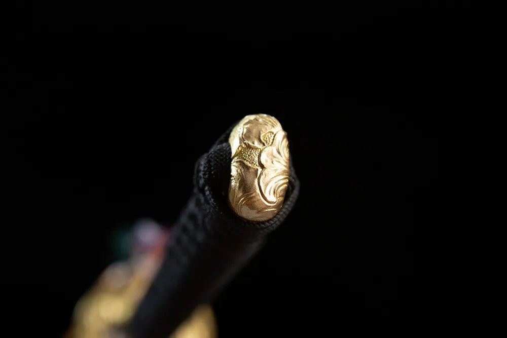 Embossed wave golden pommel cap detail