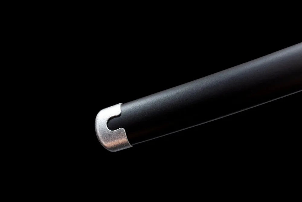 Bottom matte‑black saya silver‑alloy end‑cap close‑up
