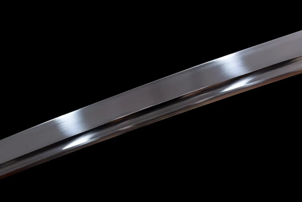 Mid‑section polished clay‑tempered tachi steel blade surface close‑up shot