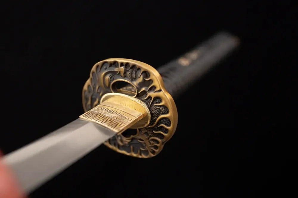 Front open‑work prajna‑hannya‑demon‑mask‑relief brass‑gilded katana hand‑guard close‑up