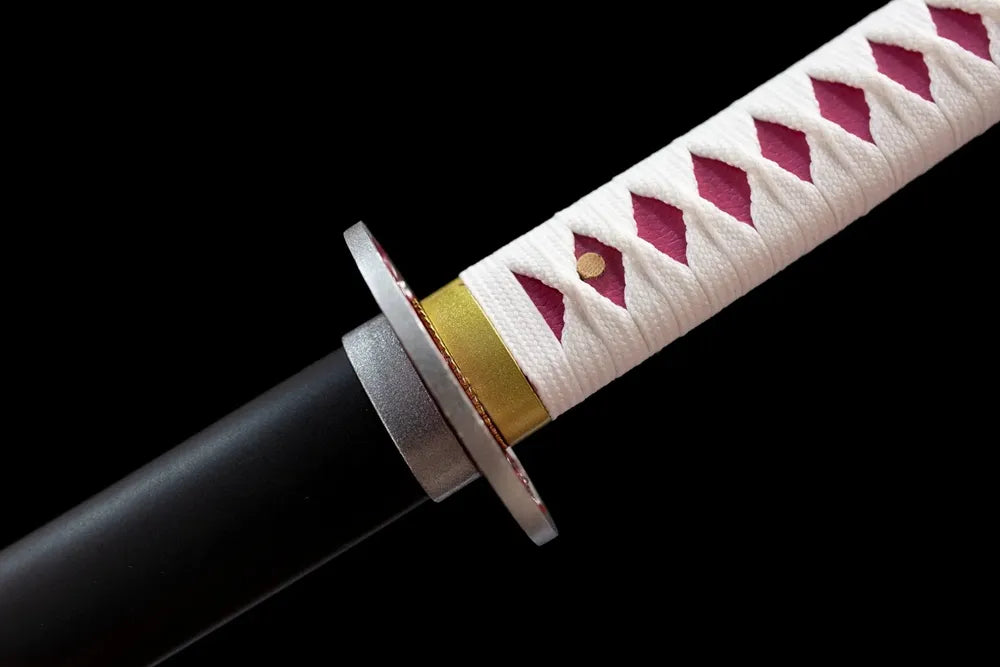 Sakura‑engraved alloy fuchi grip‑ring macro close‑up