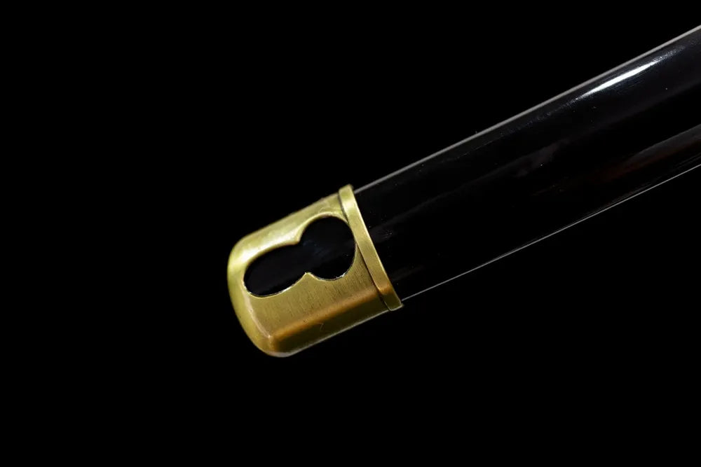 Bottom black lacquer saya antique brass end‑cap close‑up