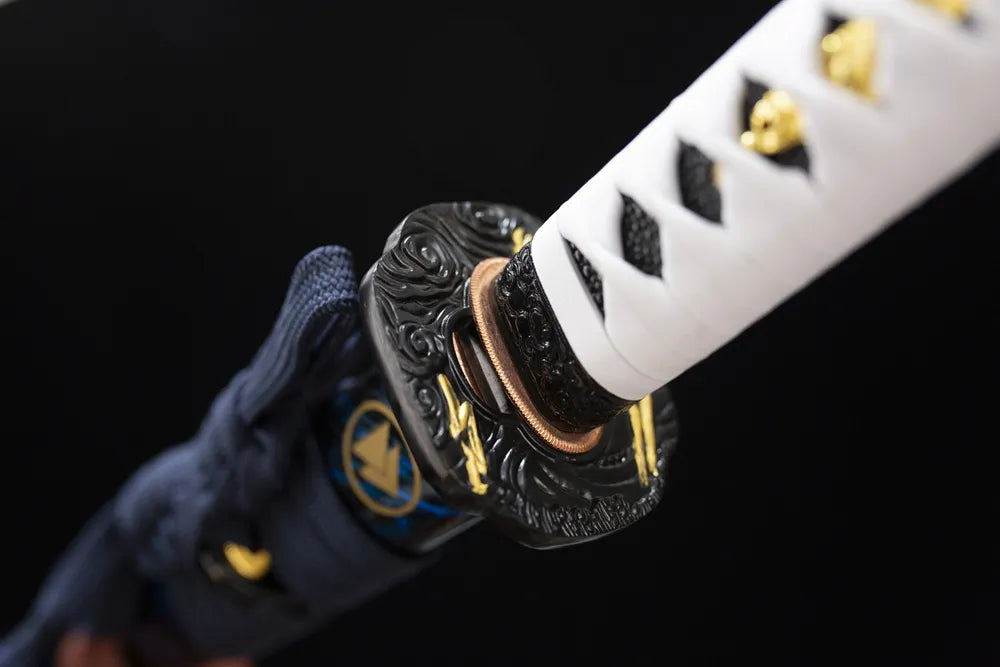 Reverse‑side cloud‑carving black‑gold aged‑alloy tsuba surface texture close‑up long katana