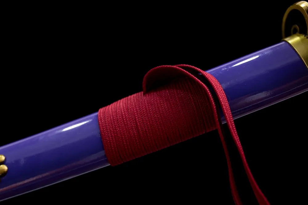 Thick dark‑red braided sage cord red‑copper fitting macro close‑up