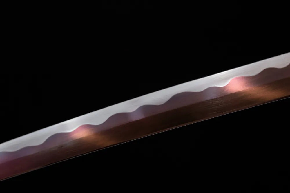 Mid‑section clean suguha neat‑straight‑pattern hamon steel wakizashi blade surface close‑up shot