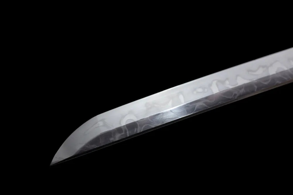 Classic smooth kissaki tip of Mo‑Meteorite katana blade close‑up view