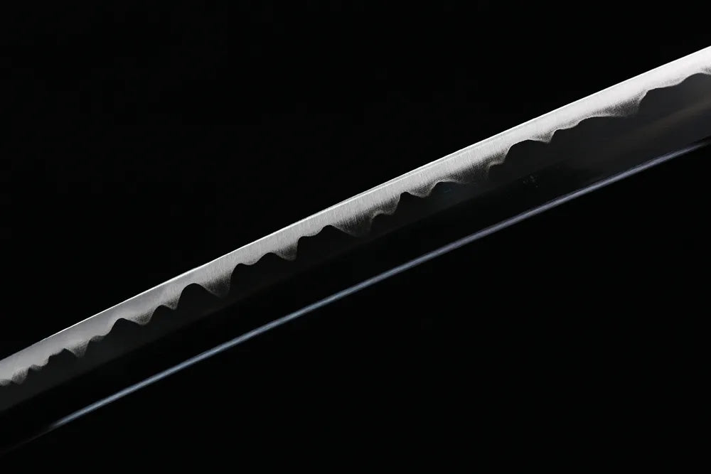 Mid‑section plain polished 1060 carbon‑steel blade texture shot