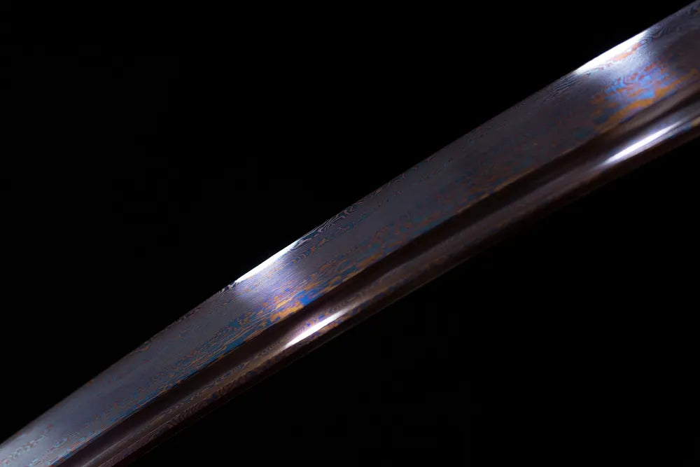 Mid‑section polished blued‑dark steel wakizashi blade surface close‑up shot