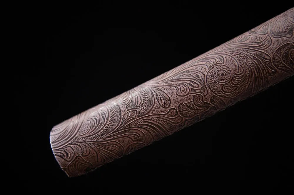 Bottom end of embossed leather saya