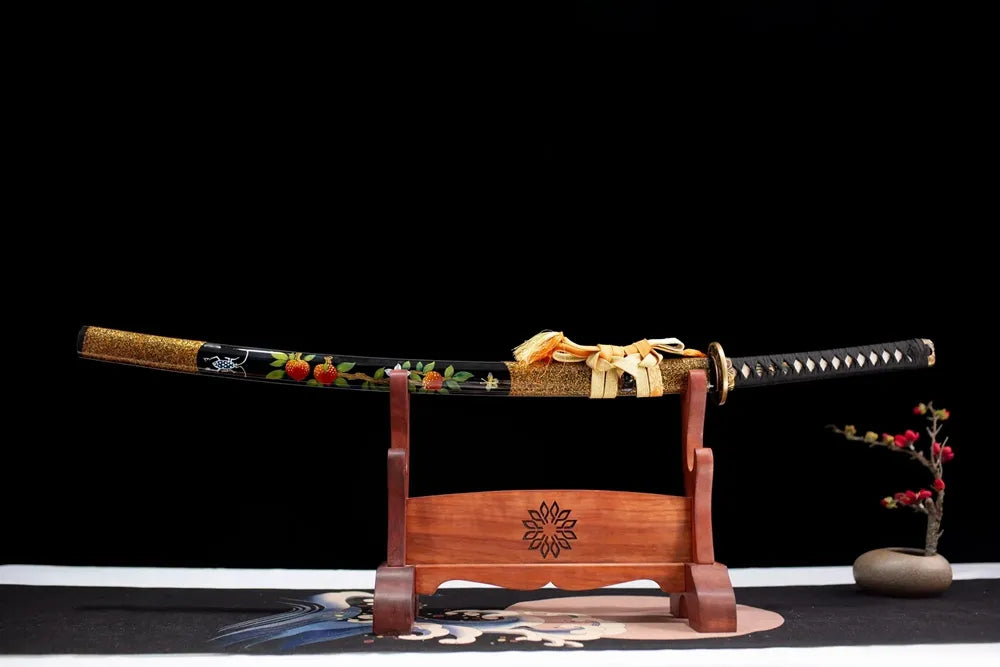 Horizontal laid closed pale‑pink‑gradient Yoshino‑Katana scabbard flat table‑top front display