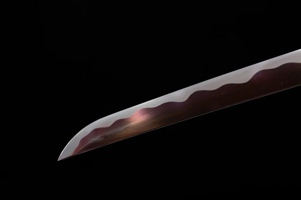 Compact practical wakizashi‑style kissaki tip of Wisp‑Red‑Wakizashi blade close‑up view