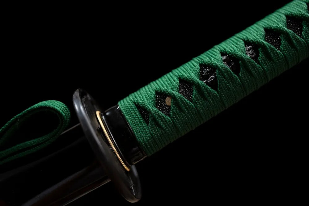 Green‑python‑relief aged‑alloy fuchi grip‑ring macro close‑up