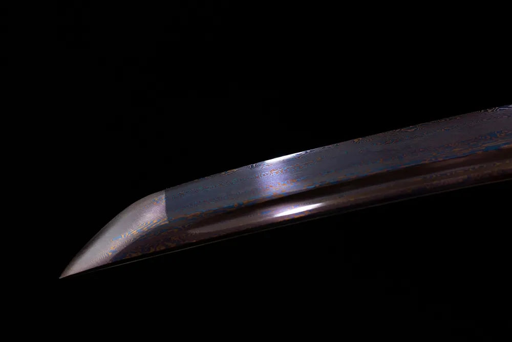Compact wakizashi‑style kissaki tip of Agate‑Wakizashi blued blade close‑up view