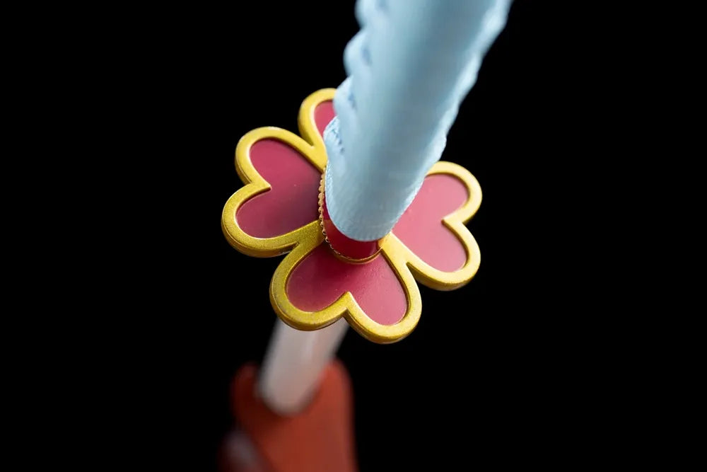 Reverse sakura‑flower outline golden alloy tsuba surface texture