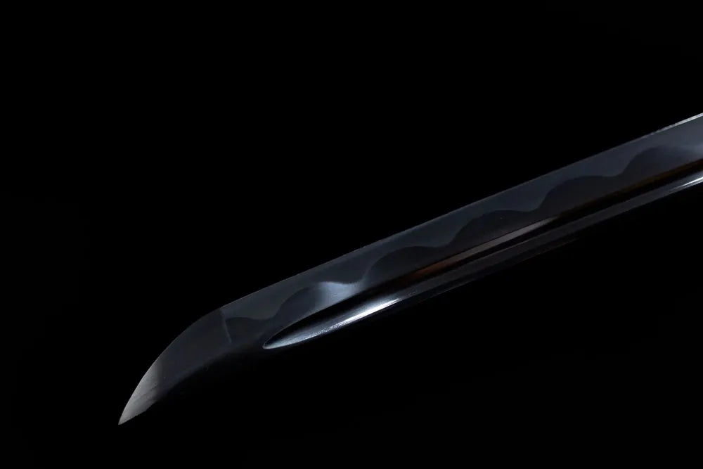 Tip section black Tensa Zangetsu blade smooth rounded kissaki close‑up