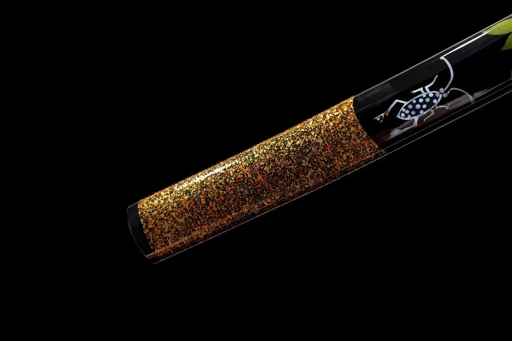 Bottom pale‑pink‑gradient saya brass‑alloy kojiri end‑cap close‑up