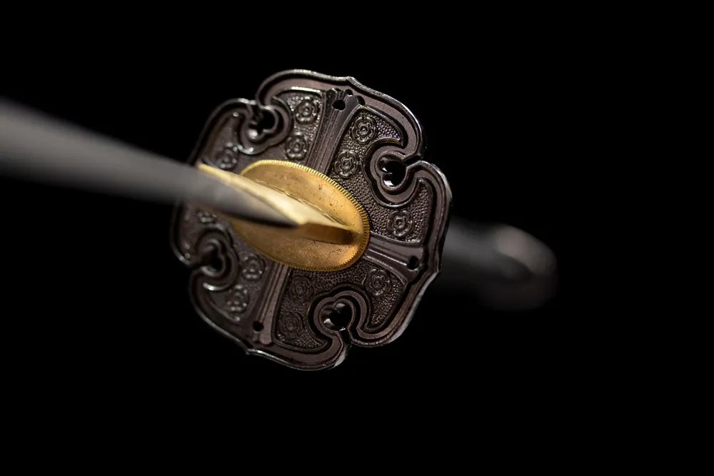 Front open‑work night‑eagle‑raptor‑relief brass‑alloy tachi hand‑guard close‑up