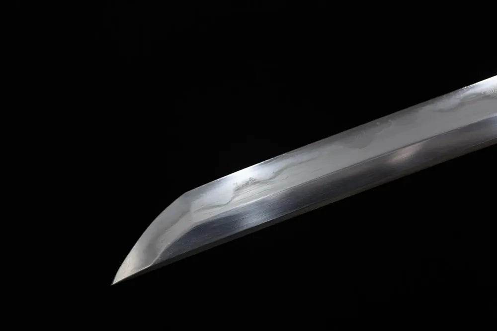Classic tachi‑style kissaki tip of Perseverance‑Tachi composite‑steel blade close‑up view