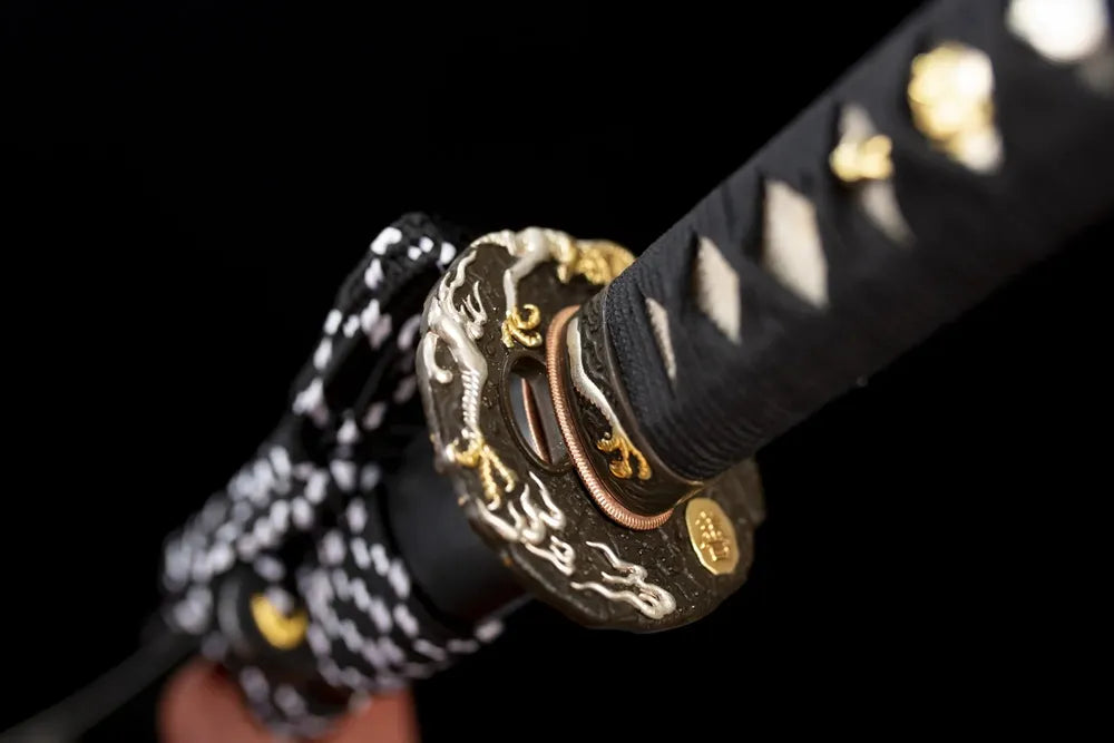 Reverse‑side thunder‑cloud‑scroll carving two‑tone aged‑copper tsuba surface texture close‑up