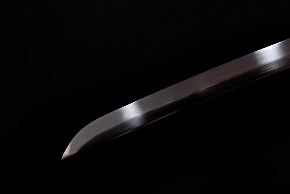 Classic functional katana‑style kissaki tip of Dragon‑Warrior‑Katana black‑oxide blade close‑up view