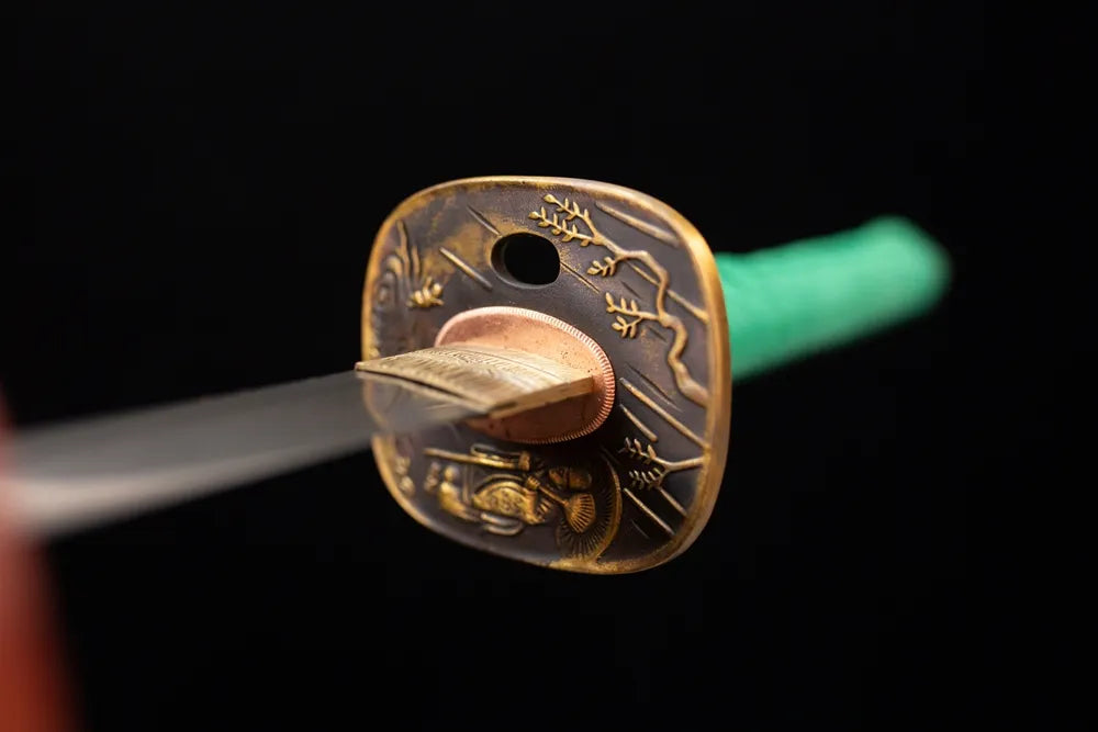 Front open‑work garden‑landscape‑tree‑relief antique‑copper katana hand‑guard close‑up