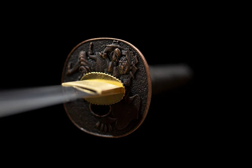 Reverse‑side smooth uncarved matte‑black alloy tsuba surface texture close‑up