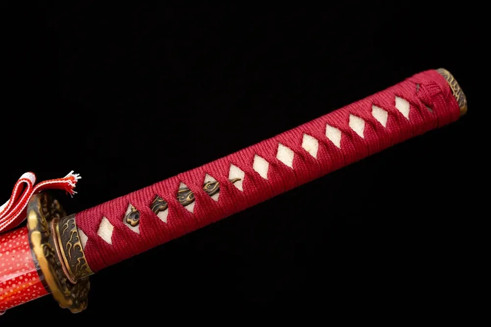 Full deep‑red woven ito tsuka antique‑copper hannya‑oni‑demon‑relief fittings complete front shot