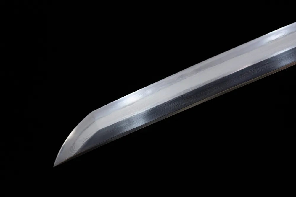 Classic functional katana‑style kissaki tip of May‑Katana blade close‑up view