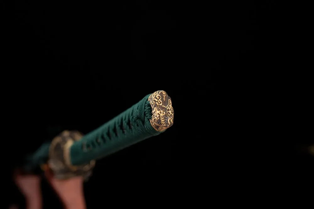 3D‑sculpted vivid‑grasshopper‑creature aged‑teal‑bronze pommel‑cap detail shot