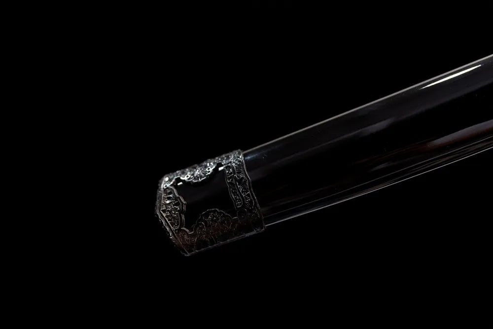 Bottom carved black alloy saya end cap close-up