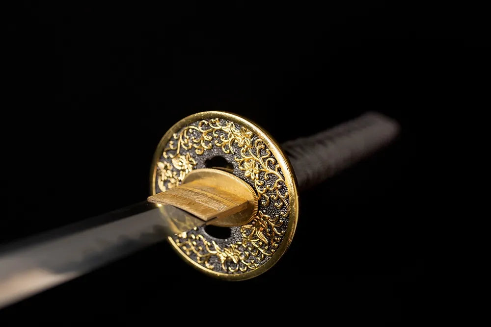 Front open‑work kamon‑hanafuda‑floral‑relief gold‑plated‑alloy katana hand‑guard close‑up