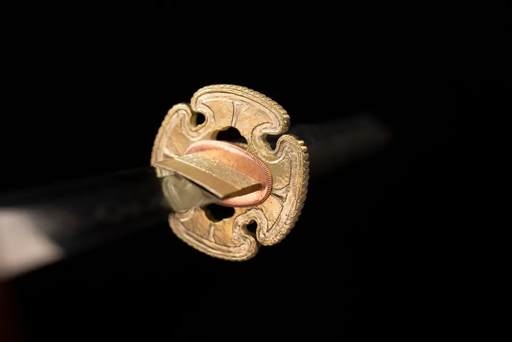 Front open‑work elf‑vine‑thorn‑relief dark‑iridescent‑silver katana hand‑guard close‑up