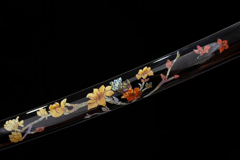 Mid‑section hand‑painted plum‑blossom artwork hardwood saya lacquer texture close‑up