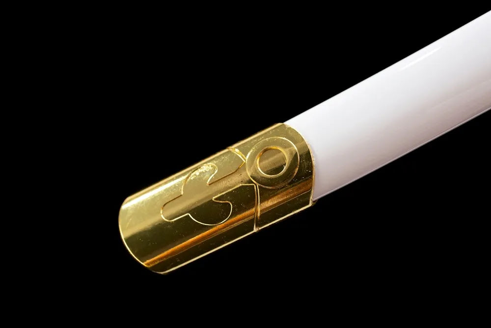 Bottom glossy white saya gold‑plated alloy end‑cap close‑up