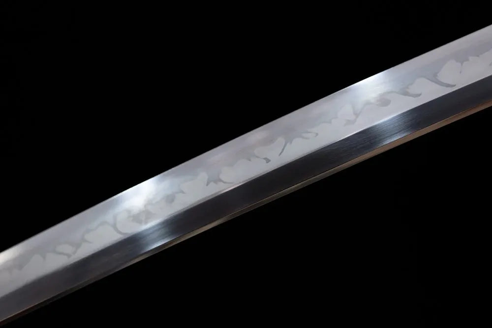 Mid‑section yahazu‑style distinct hamon steel katana blade surface close‑up shot