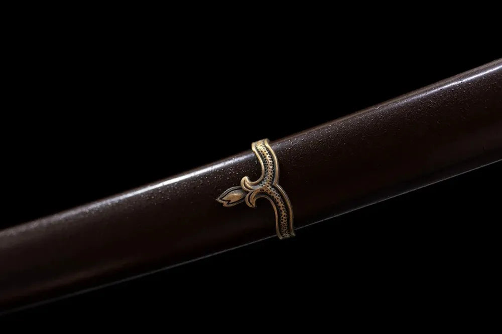 Mid‑section dark‑brown vintage lacquer hardwood saya military metal ring fitting texture close‑up