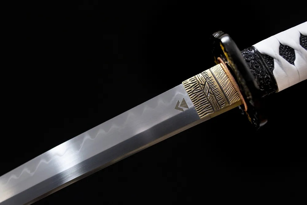 Upper T10 clay‑tempered long katana blade brass habaki sanbonsugi three‑peak hamon temper‑line macro close‑up
