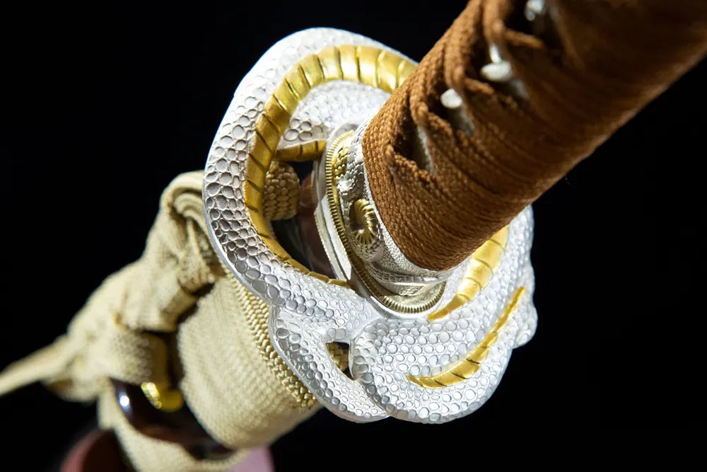 Reverse snake patterned alloy tsuba