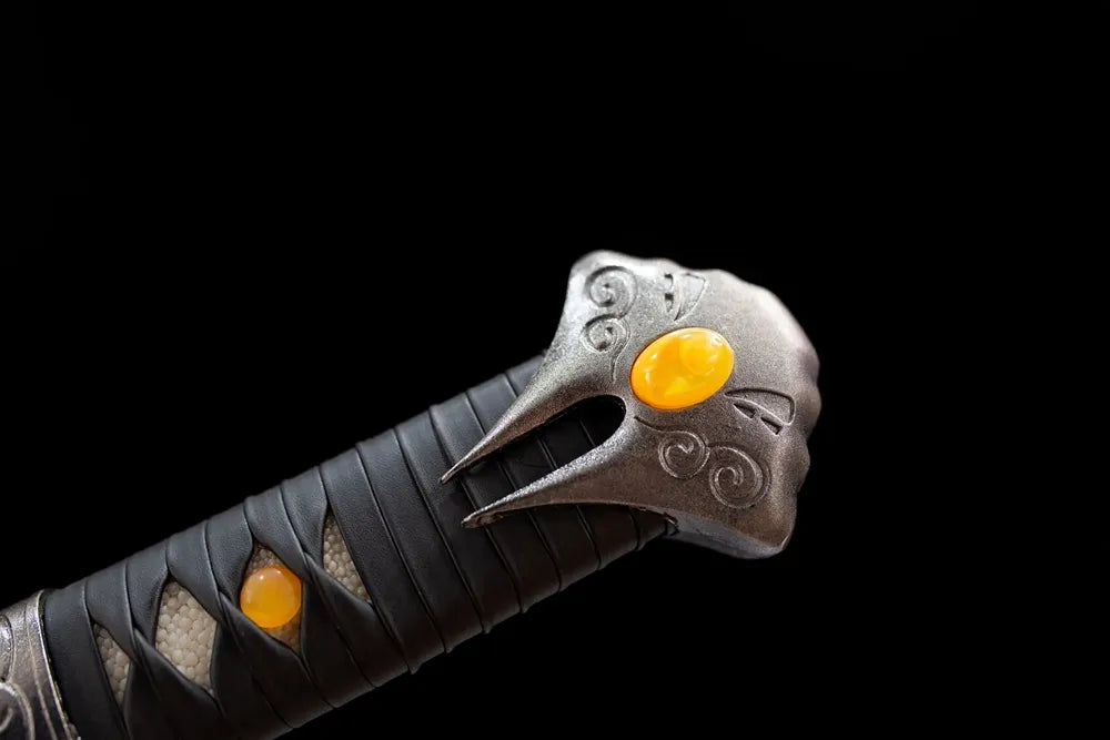 Top 3D evil ghost mask kashira with amber stone pommel close-up