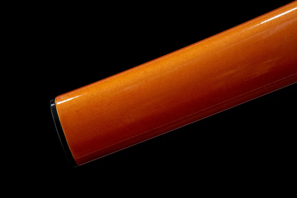 Bottom saya closeup black end cap golden metal trim detail