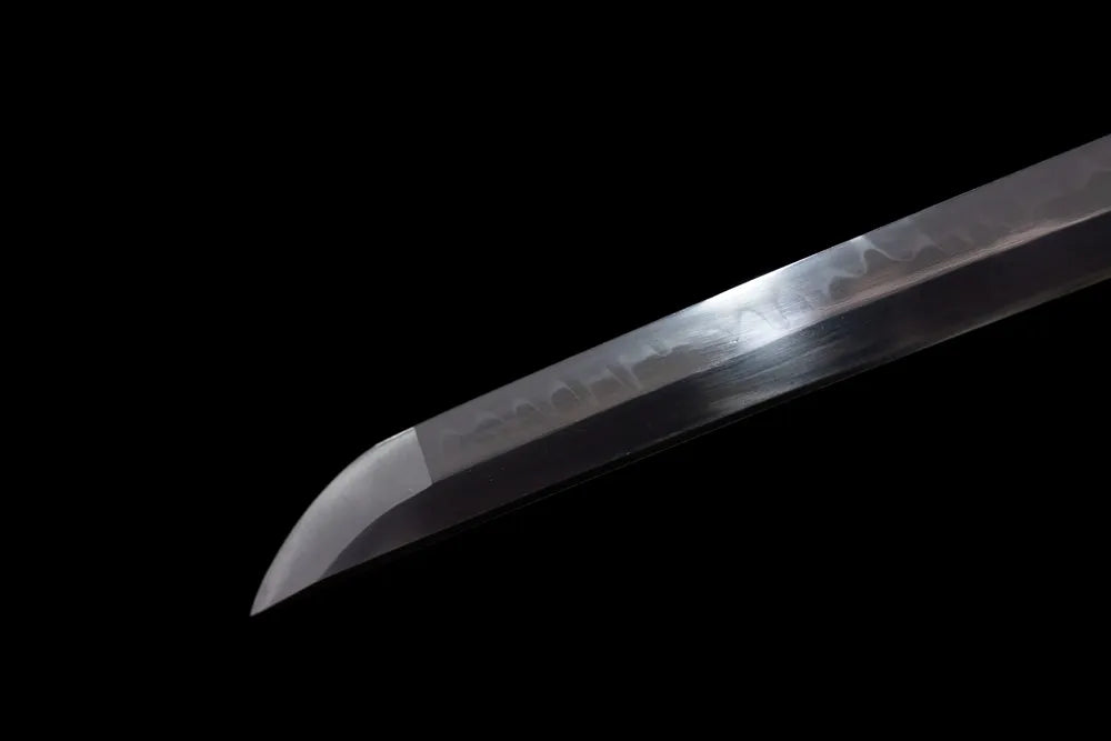 Extended elegant tachi‑style kissaki tip of Tachi‑Green‑Sakuragawa blade close‑up view